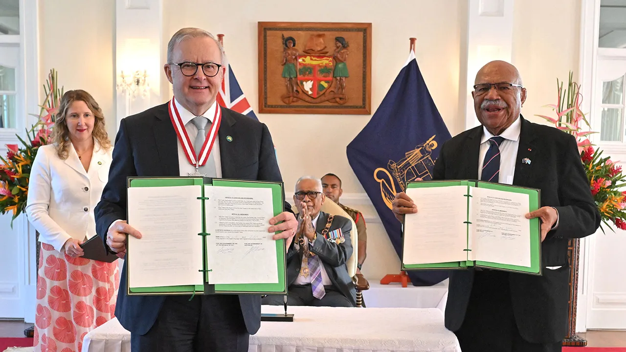 Australia’s Prime Minister Anthony Albanese and Fiji’s Prime Minister Sitiveni Rabuka pose for a picture after signing a treaty and an alliance, as Fiji’s President Ratu Naiqama Lalabalavu looks on at State House in Suva, Fiji, July 6, 2026. AAP/Mick Tsikas via REUTERS 