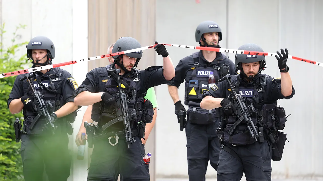 The Support Unit (USK), a specialized unit of the Bavarian police, is moving through the grounds of the Welfen Gymnasium, Schongau, Germany, Wednesday, July 8, 2026. (Karl-Josef Hildenbrand/dpa via AP)