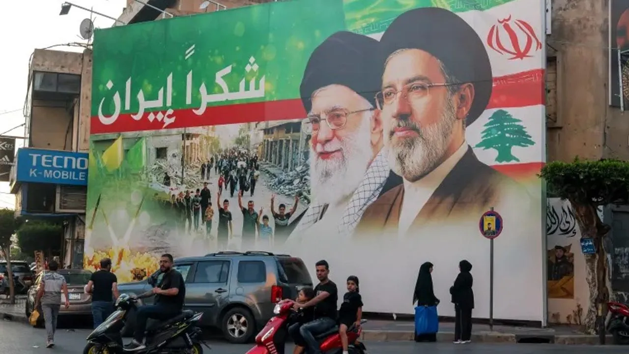 A billboard shows portraits of Iran’s new Supreme Leader Mojtaba Khamenei, right, and his father, the late Ayatollah Ali Khamenei, with the words ‘Thank you, Iran’ written across it, in Beirut, Lebanon, in June 2026 [File: Wael Hamzeh/EPA]