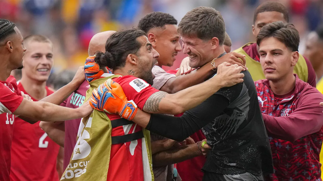 Switzerland goalkeeper Gregor Kobel (1) celebrates with his teammates after winning a penalty shootout in the World Cup round of 16 soccer match between Switzerland and Colombia in Vancouver, British Columbia, Tuesday, July 7, 2026. (Darryl Dyck/The Canadian Press via AP)