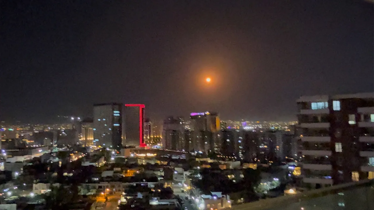 A drone is intercepted in the sky over Erbil, Iraq, July 15, 2026, in this screengrab obtained from a social media video. Dlawer/X/via REUTERS THIS IMAGE HAS BEEN SUPPLIED BY A THIRD PARTY. MANDATORY CREDIT. VERIFICATION: - Buildings and road layout matched satellite and archive imagery - Date verified by original file metadata - An explosive-laden drone was shot down by air defenses over Iraq's Erbil, security sources told Reuters on July 15