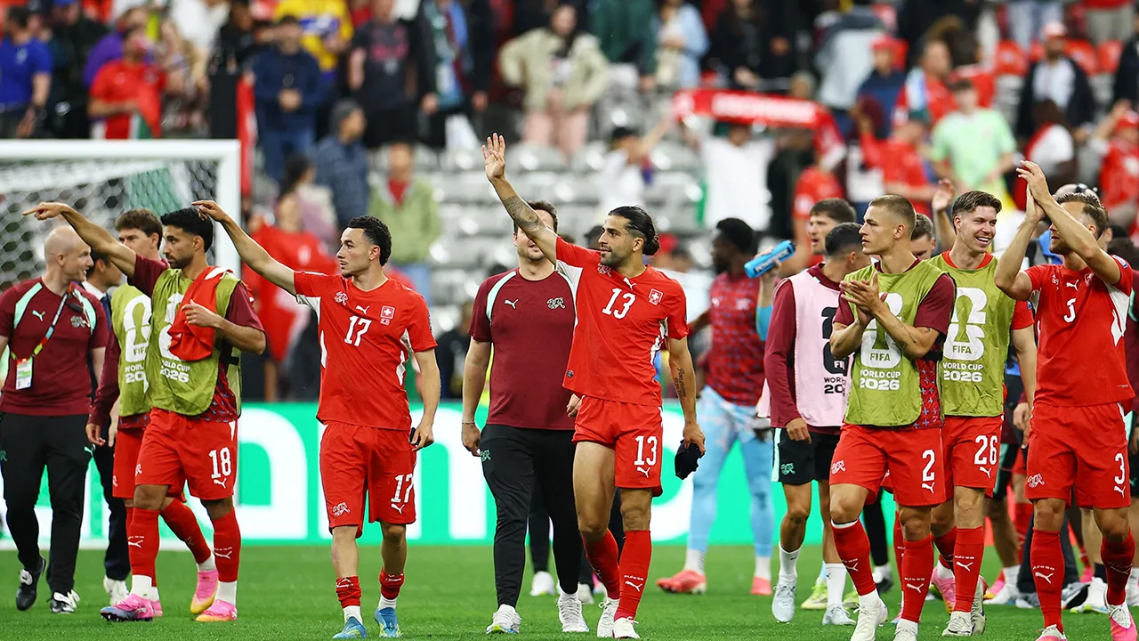 Soccer Football - FIFA World Cup 2026 - Round of 32 - Switzerland v Algeria - BC Place, Vancouver, Canada - July 2, 2026 Switzerland's Ricardo Rodriguez and Ruben Vargas celebrate after the match with teammates REUTERS/Agustin Marcarian