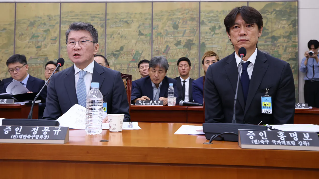 Former South Korean men's national team head coach Hong Myung-bo, right, and former KFA President Chung Mong-gyu, left, attend a hearing on the Korea Football Association (KFA) amid a controversy surrounding the management of the sport's national governing body and its impact on the team's World Cup performance, at the National Assembly Thursday, July 30, 2026, in Seoul, South Korea.(Chung Sung-Jun/Pool Photo via AP)