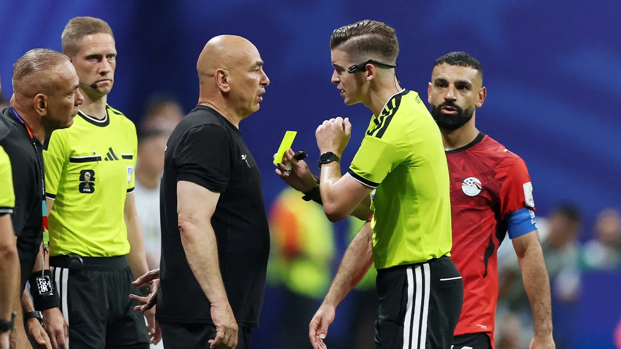 Soccer Football - FIFA World Cup 2026 - Round of 16 - Argentina v Egypt - Atlanta Stadium, Atlanta, Georgia, U.S. - July 7, 2026 Egypt coach Hossam Hassan is shown a yellow card by referee Francois Letexier REUTERS/Paul Childs TPX IMAGES OF THE DAY