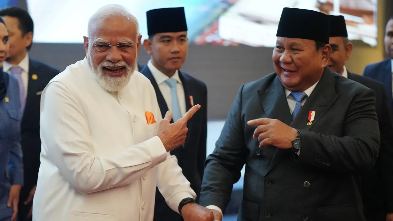 India's Prime Minister Narendra Modi, left, shares a light moment with Indonesian President Prabowo Subianto as Vice President Gibran Rakabuming Raka, center, looks on, during their visit at the parliament building in Jakarta, Indonesia, Tuesday, July 7, 2026. (AP Photo/Tatan Syuflana)