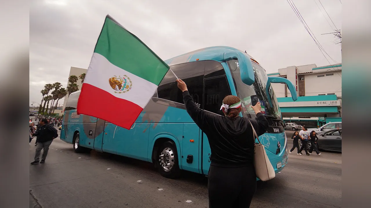 Soccer Football - FIFA World Cup 2026 - Iran depart from Tijuana after being eliminated from the World Cup - Tijuana, Mexico - June 30, 2026 Fans reacts outside the team hotel as they depart from Tijuana REUTERS/Victor Medina