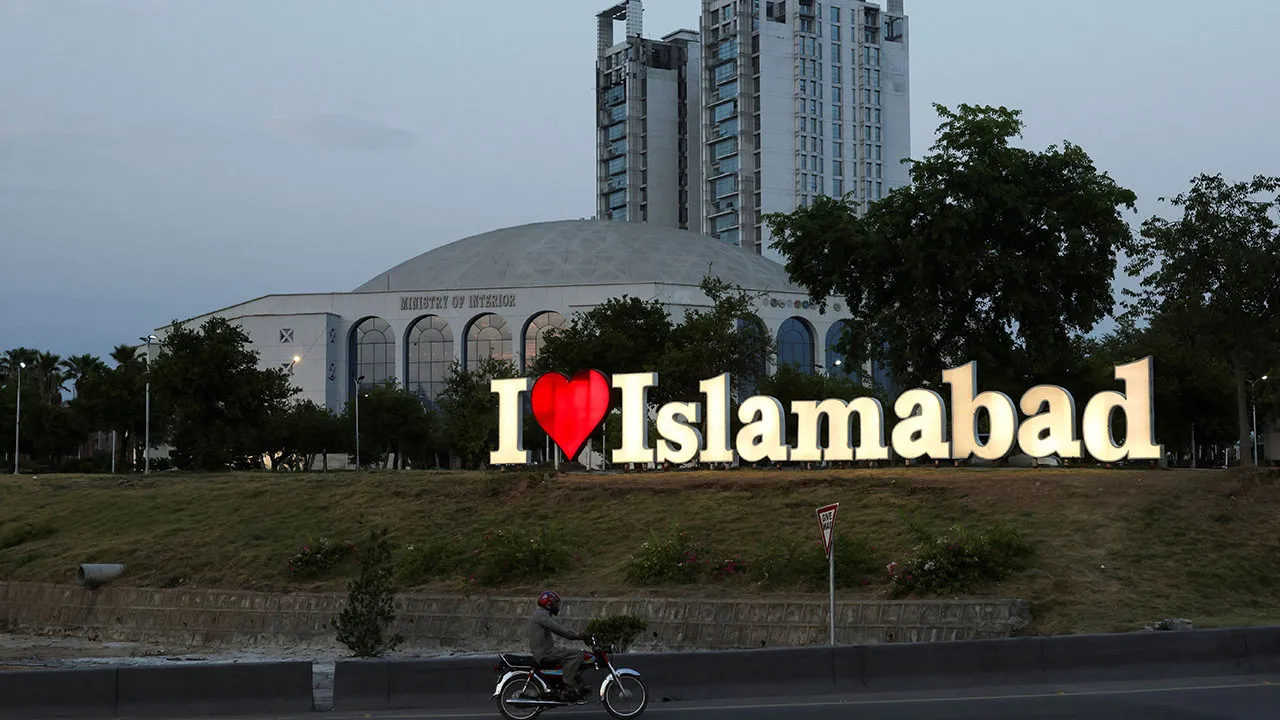 A man on a motorbike rides past the 'I Love Islamabad' sign in Islamabad, Pakistan, June 16, 2026. REUTERS/Akhtar Soomro