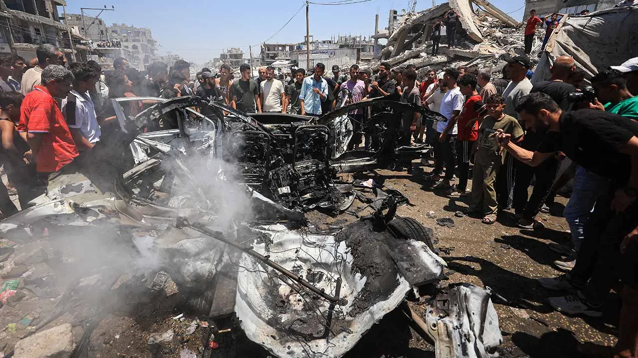 Palestinians inspect the site of an Israeli strike on a vehicle in Gaza City, July 20, 2026. REUTERS/Dawoud Abu Alkas