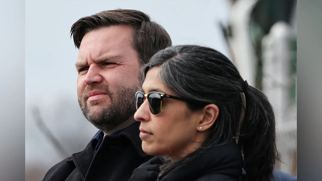FILE PHOTO: U.S. Vice President JD Vance and second lady Usha Vance visit the site of a 2023 train derailment in East Palestine, Ohio, U.S., February 3, 2025. Rebecca Droke/Pool via REUTERS/File Photo