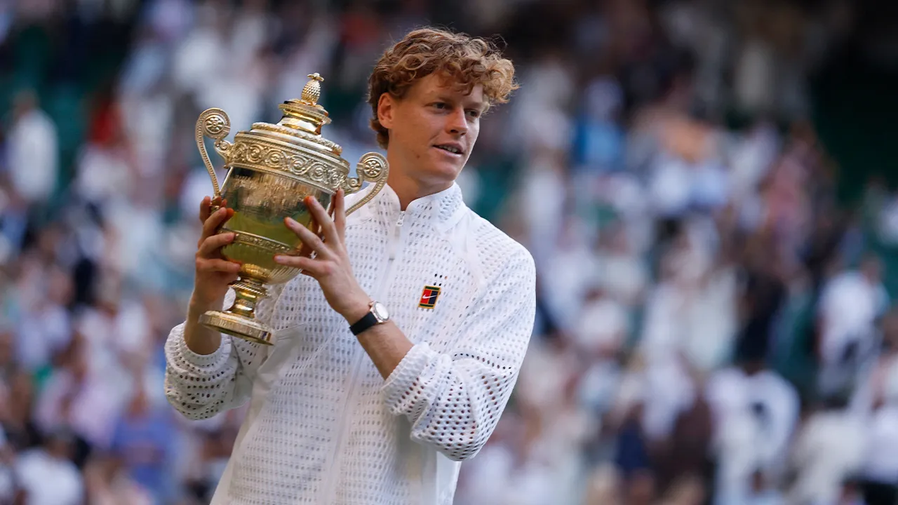 Tennis - Wimbledon - All England Lawn Tennis and Croquet Club, London, Britain - July 12, 2026 Italy's Jannik Sinner celebrates with the trophy after winning his final match against Germany's Alexander Zverev REUTERS/Andrew Couldridge