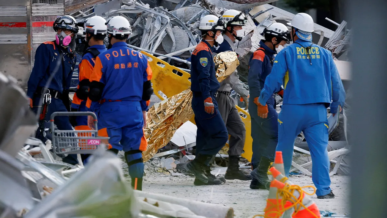 Rescue workers conduct a search operation at the damaged Aeon Mall shopping centre after an earthquake with a magnitude of 7.1 struck Japan's southern Kumamoto Prefecture, in Kashima Town, Kumamoto Prefecture, Japan, July 30, 2026. REUTERS/Kim Kyung-Hoon REFILE - QUALITY REPEAT