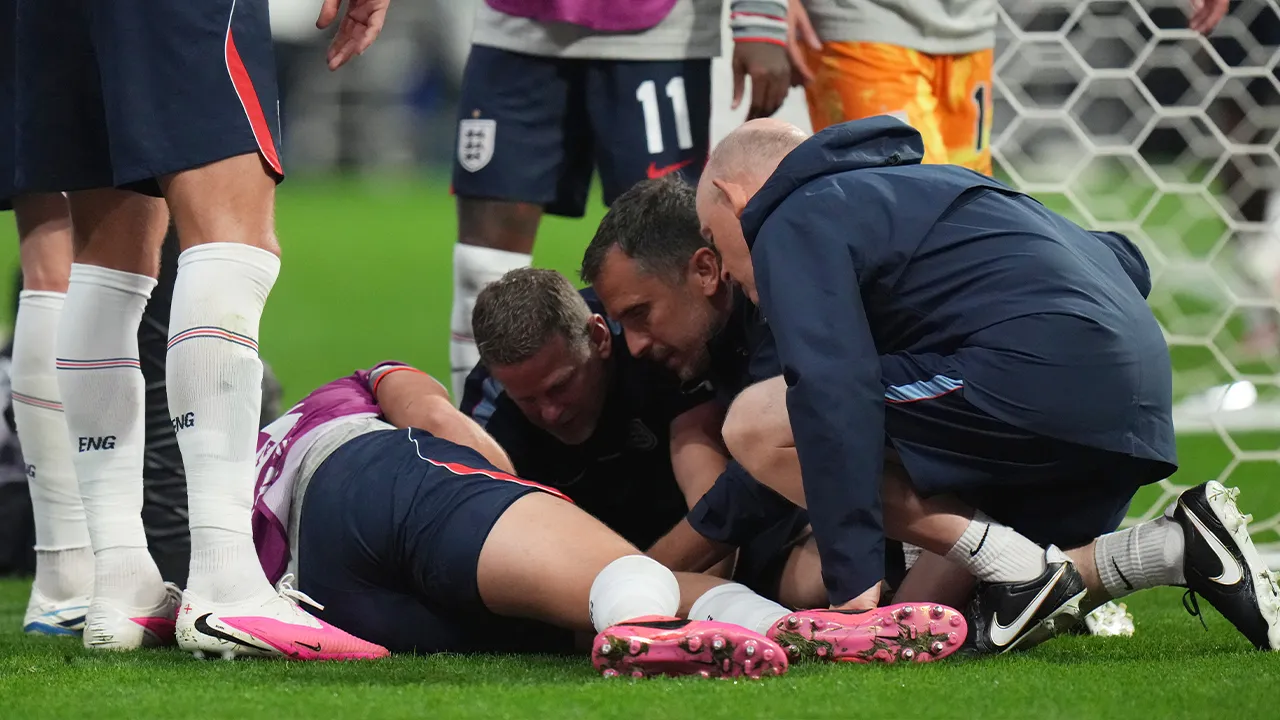 England's Jordan Henderson (14) is looked after by training staff following an injury in the postgame celebration in the World Cup round of 16 soccer match between Mexico and England in Mexico City, Sunday, July 5, 2026. (AP Photo/Eduardo Verdugo)