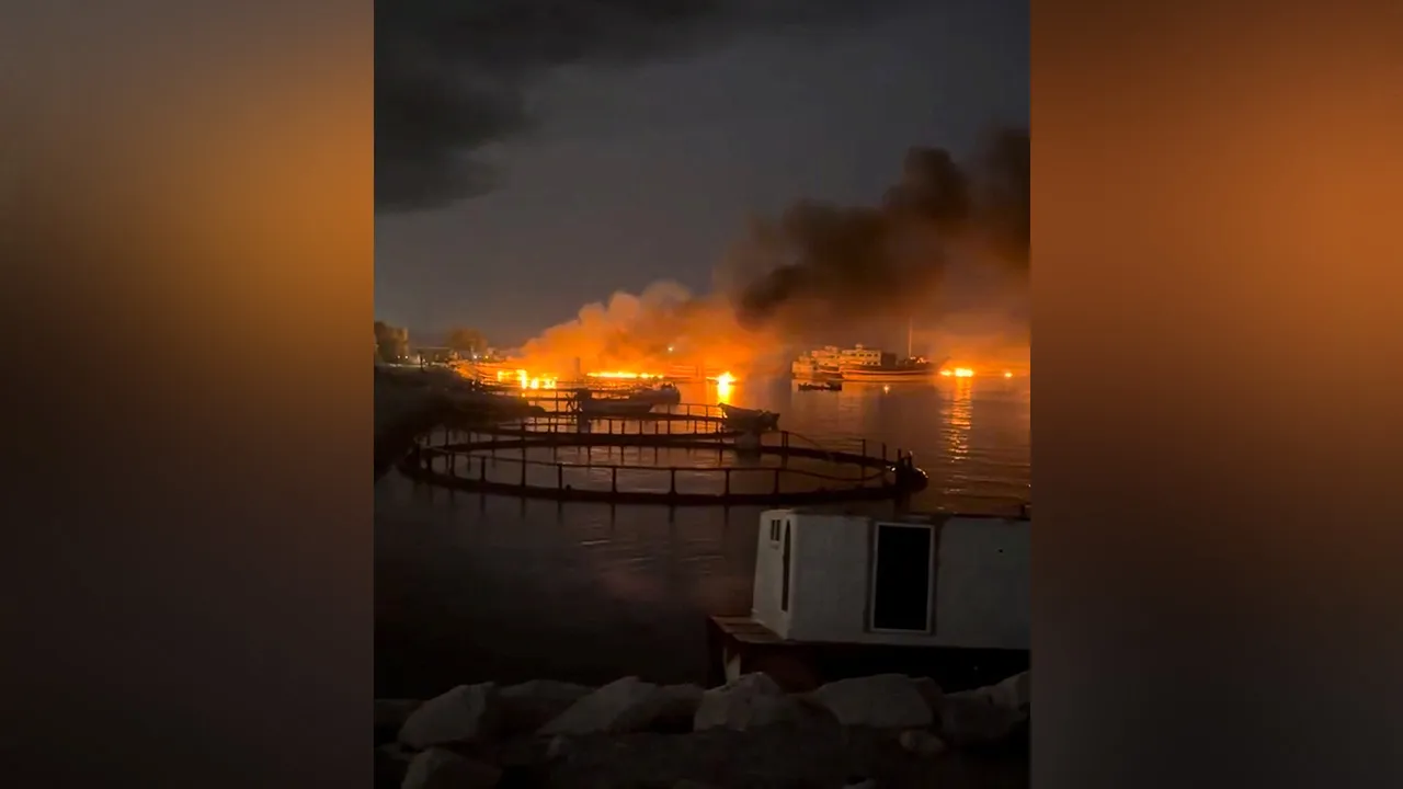 Smoke rises from a port, near Strait of Hormuz, following a U.S. strike in Kuhestak, Hormozgan Province, Iran, July 8, 2026, in this screengrab obtained from a social media video. Social Media/via REUTERS 