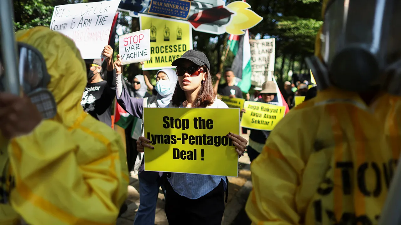 Malaysian activists hold placards bearing slogans, protesting Lynas Corp's four-year rare earth supply agreement with the U.S. Department of Defense in Malaysia, which hosts the world's largest rare earth processing plant outside China operated by Australia's Lynas Corp, at Kuala Lumpur, Malaysia, July 6, 2026. REUTERS/Hasnoor Hussain