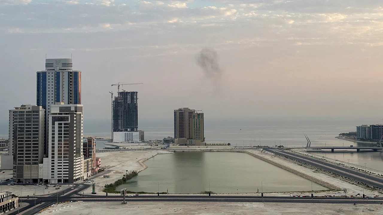Smoke rises after a drone was intercepted during early morning hours in Manama, Bahrain, July 14, 2026. REUTERS/Stringer