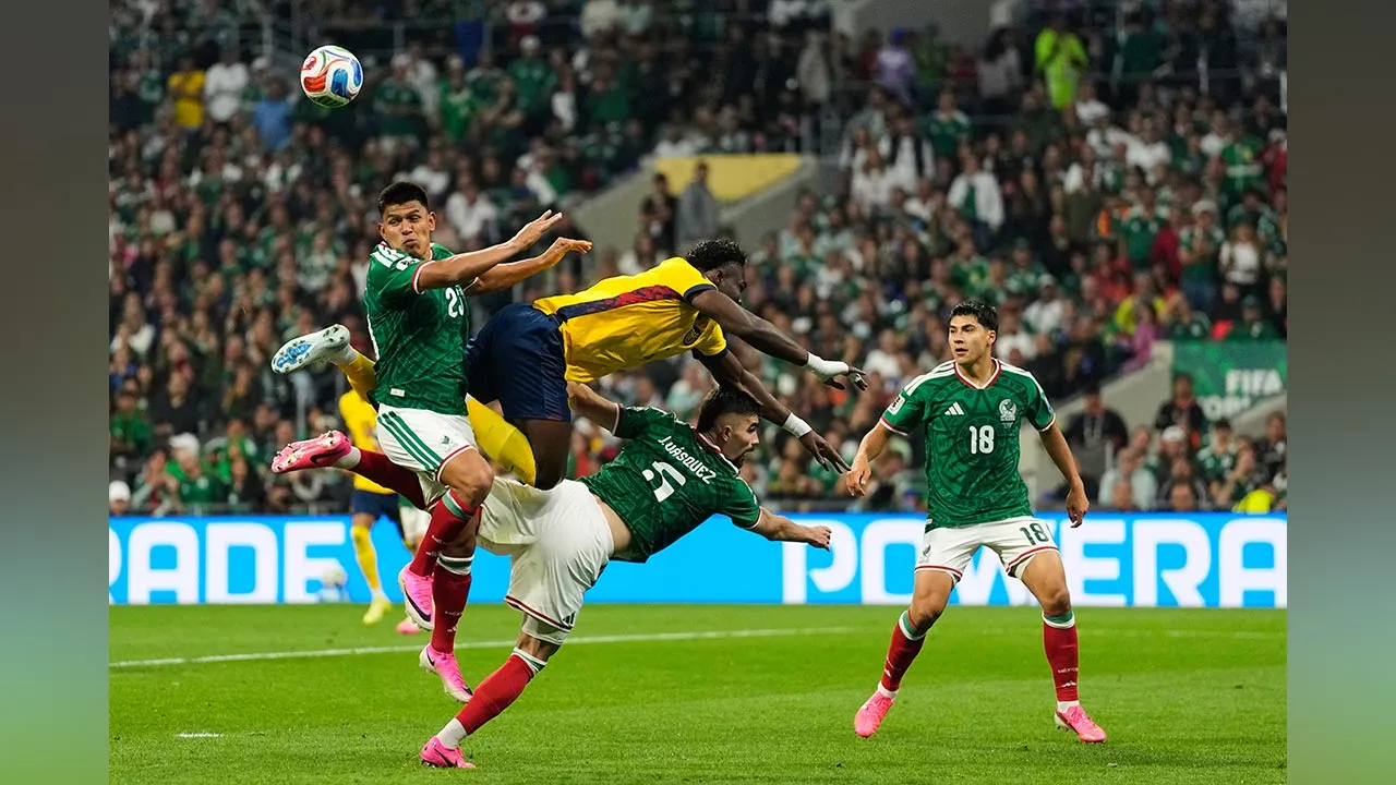 Mexico's Jesus Gallardo, left, jumps for the ball with Ecuador's Jordy Caicedo during the World Cup round of 32 soccer match in Mexico City, Tuesday, June 30, 2026. (AP Photo/Ricardo Mazalan)