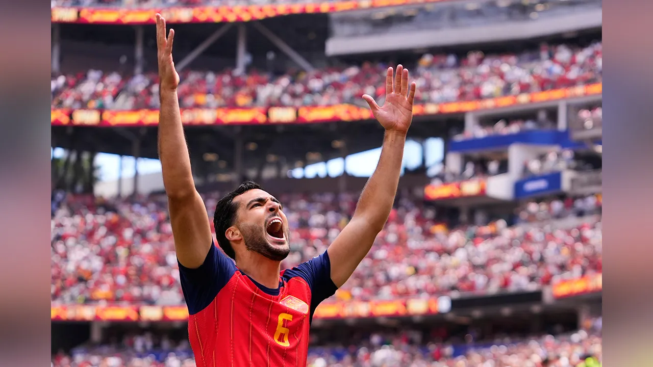 Spain's Mikel Merino (6) celebrates scoring their second goal during the World Cup quarterfinal soccer match between Spain and Belgium in Inglewood, Calif., near Los Angeles, Friday, July 10, 2026. (AP Photo/Mark J. Terrill)