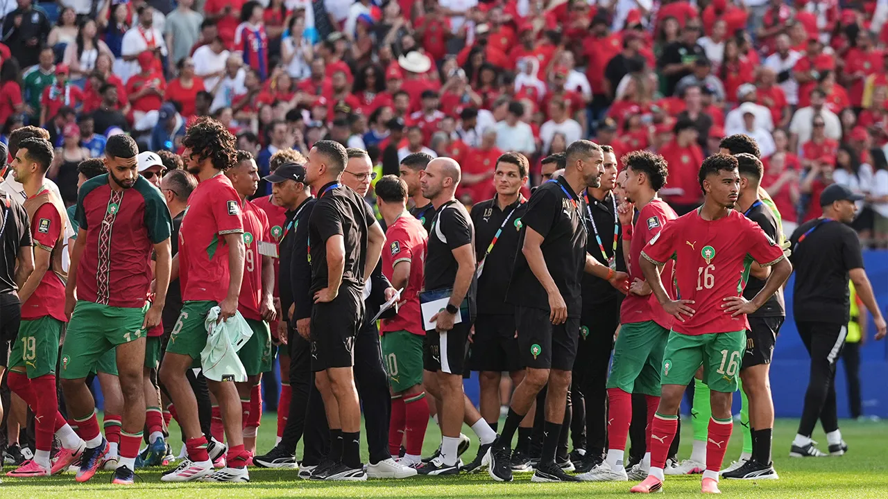 Morocco team and staff walk off the pitch after the World Cup quarterfinal soccer match between France and Morocco in Foxborough, Mass., near Boston, Thursday, July 9, 2026. (AP Photo/Stephanie Scarbrough)