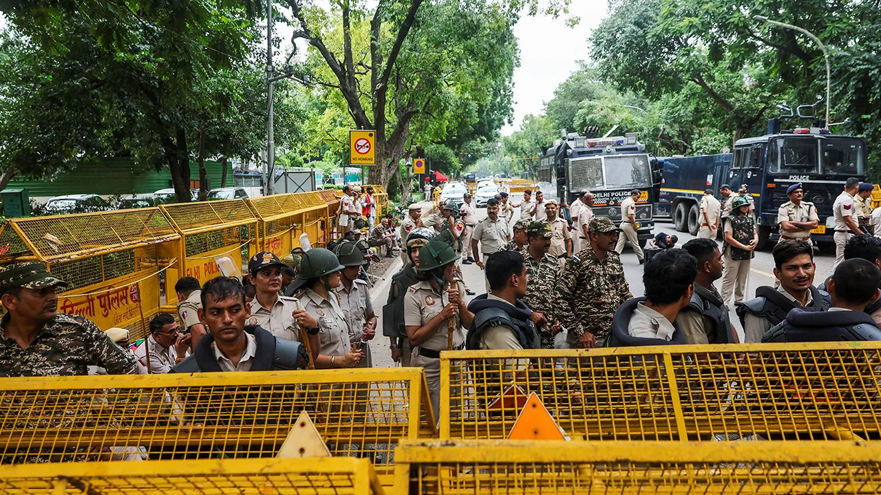 Police personnel stand guard outside Minister of Education of India Dharmendra Pradhan's residence, as supporters of India's Cockroach Janata Party (CJP) demonstrate during the ongoing protests, a few days after thousands of protesters marched towards parliament demanding the resignation of Education Minister over National Eligibility cum Entrance Test (NEET) examination paper leaks, in New Delhi, India, July 23, 2026. REUTERS