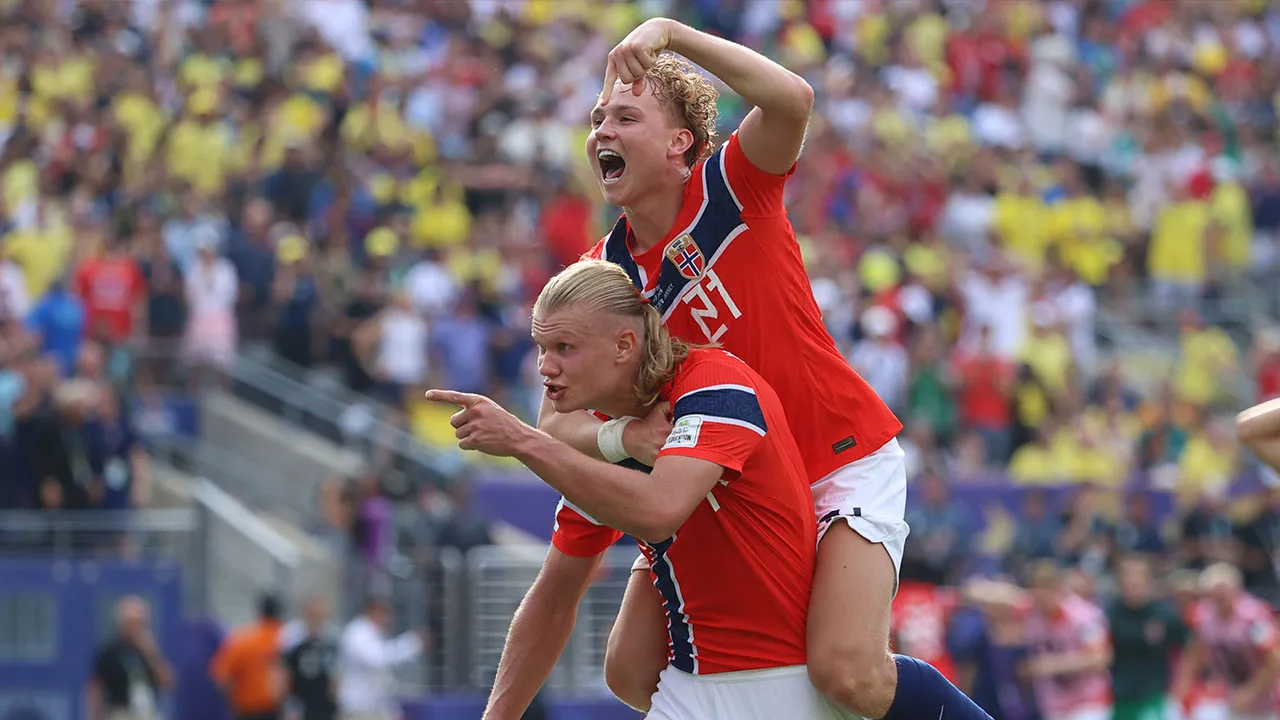 Norway's Erling Haaland (9) celebrates with Andreas Schjelderup (21) after scoring their second goal during the World Cup round of 16 soccer match between Brazil and Norway in East Rutherford, N.J., near New York, Sunday, July 5, 2026. (AP Photo/Pamela Smith)