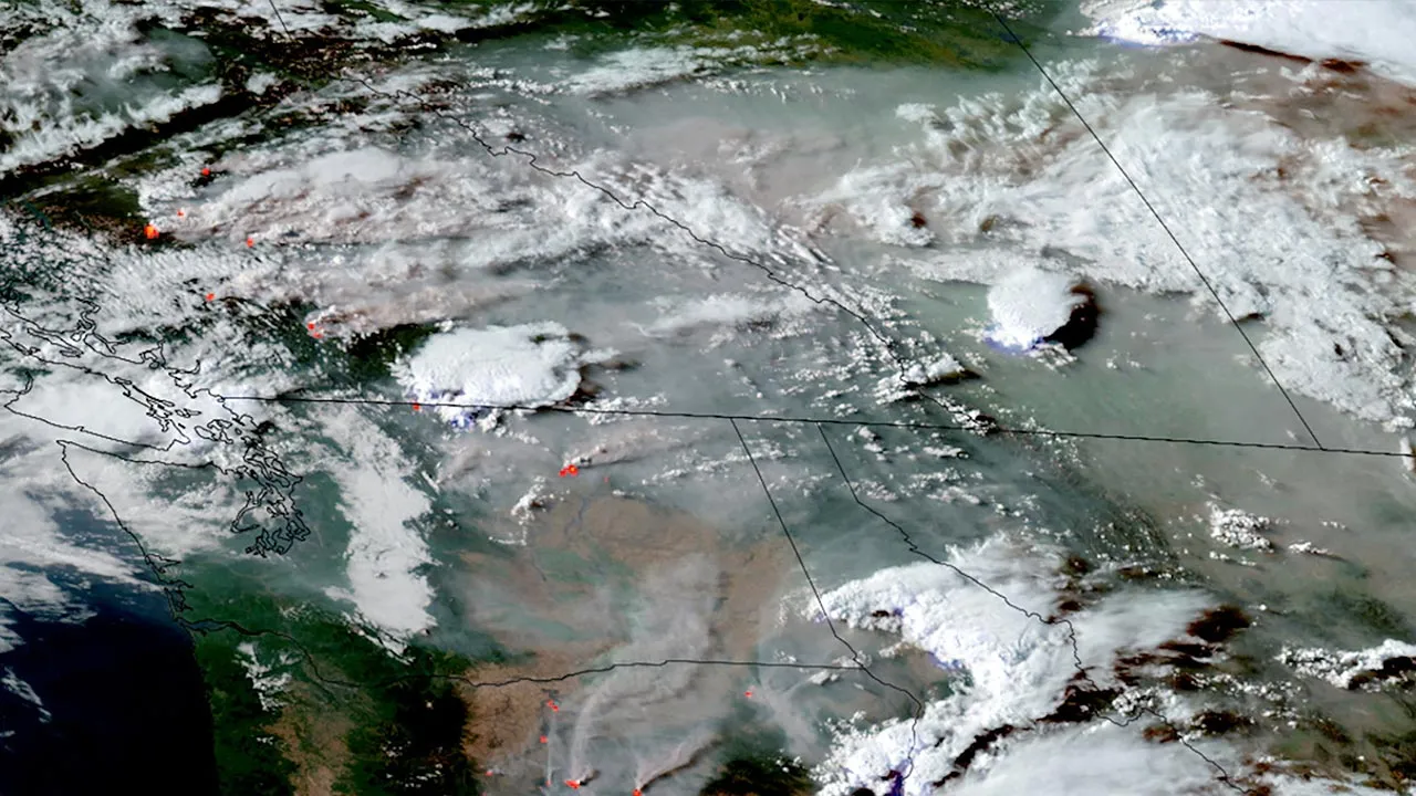 A satellite image shows smoke from wildfires in Oregon, Washington state and the Canadian province of British Columbia drifting eastward in North America, July 24, 2026. CSU/CIRA & NOAA/Handout via REUTERS