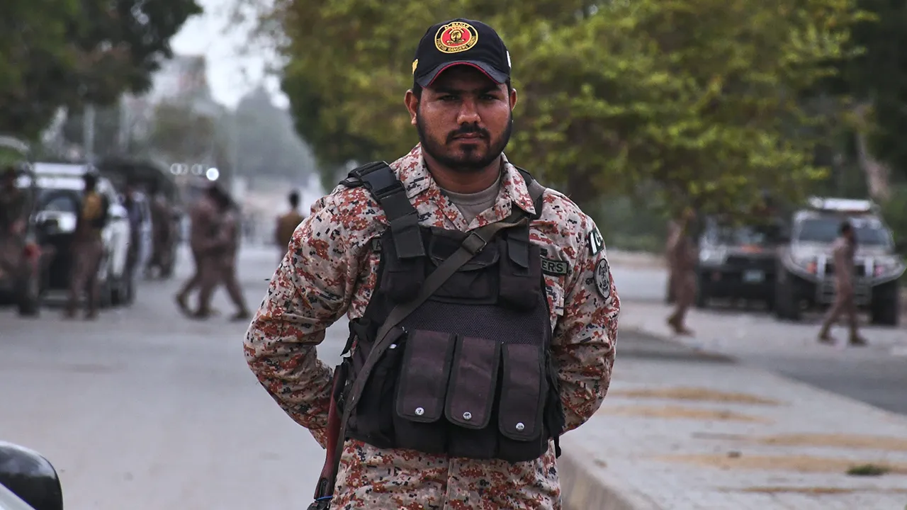 Paramilitary soldiers stand guard on a road cordoned off near the site of a militant attack at the provincial headquarters of the paramilitary Pakistan Rangers in Karachi, Pakistan, Sunday, June 28, 2026. (AP Photo/Ali Raza)