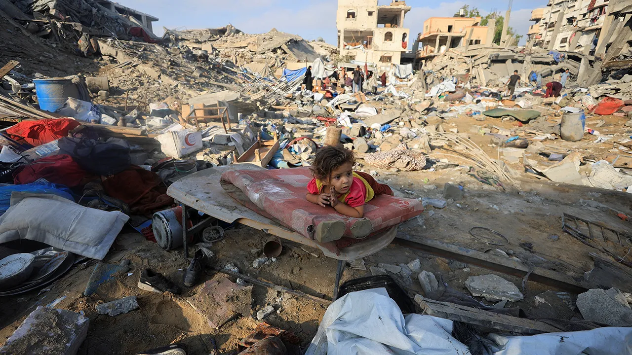 A Palestinian child lies on a damaged mattress at the site of Wednesday's Israeli strike on a house whose residents were pre-warned by the Israeli military to evacuate, in Gaza City, July 30, 2026. REUTERS