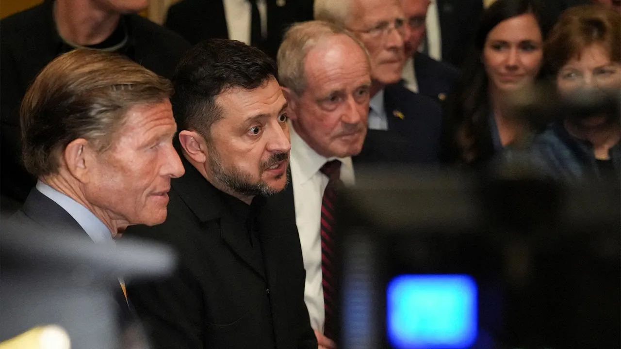 Ukraine's President Volodymyr Zelenskiy speaks with the media as he leaves following a meeting with U.S. senators on the Lindsey O. Graham Sanctioning Russia and Iran Act at the U.S. Capitol in Washington, D.C., U.S., July 28, 2026. REUTERS/Eric Lee