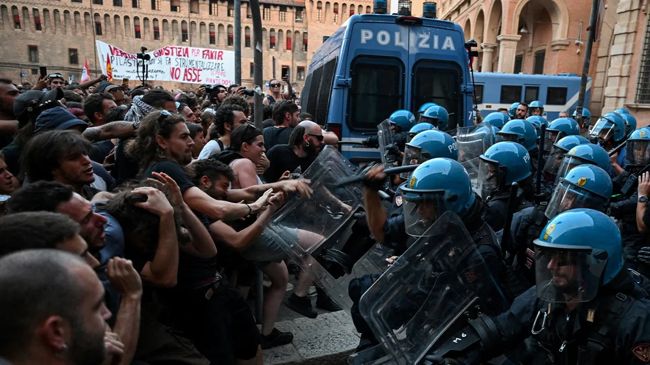 Protesters clash with riot police during a protest following the death of Abderrahim Fakir after he was restrained by police during an attempted detention, in Bologna, Italy, July 20, 2026. REUTERS/Michele Lapini TPX IMAGES OF THE DAY