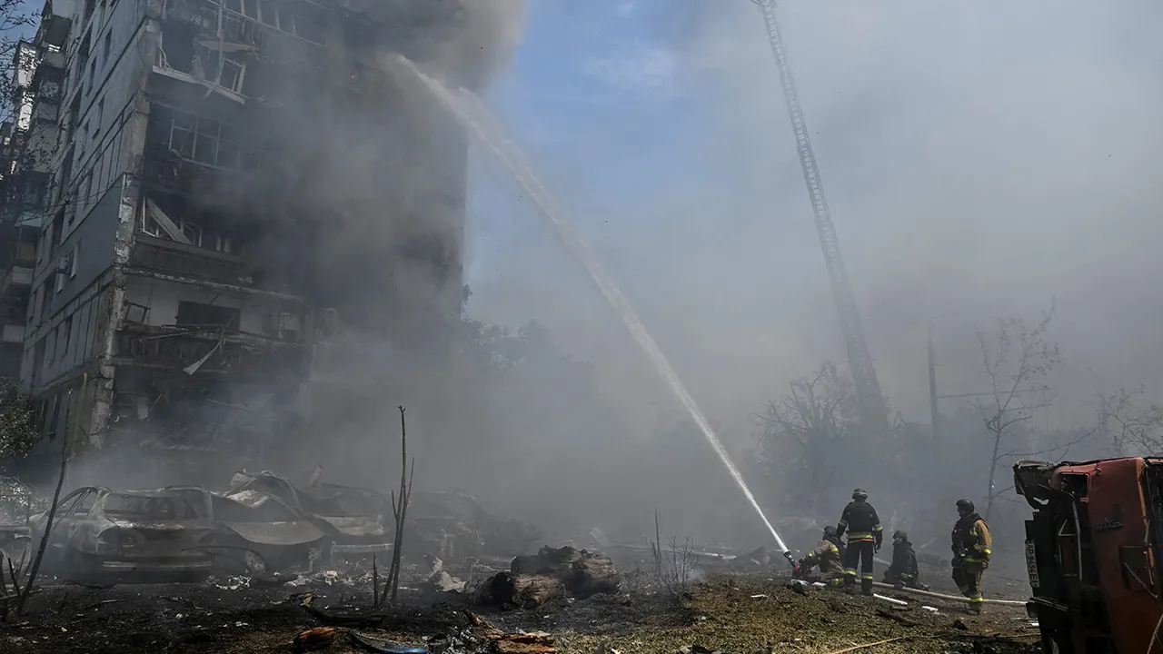 Firefighters work at the site of an apartment building hit by a Russian air strike, amid Russia's attack on Ukraine, in Zaporizhzhia, Ukraine, July 21, 2026. REUTERS/Stringer