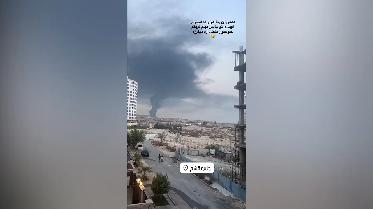 A plume of smoke rises after reported strikes, from Qeshm, Iran, July 30, 2026, in this screengrab obtained from a social media video. Social Media/via REUTERS THIS IMAGE HAS BEEN SUPPLIED BY A THIRD PARTY. NO RESALES. NO ARCHIVES. OVERLAY FROM SOURCE. NEWS USE ONLY. Verificarion lines : Reuters confirmed the location from road layout, buildings and vegetation which matched archive and satellite images. Corroborating video showed smoke of similar shape rising from the island. Date confirmed by official and 