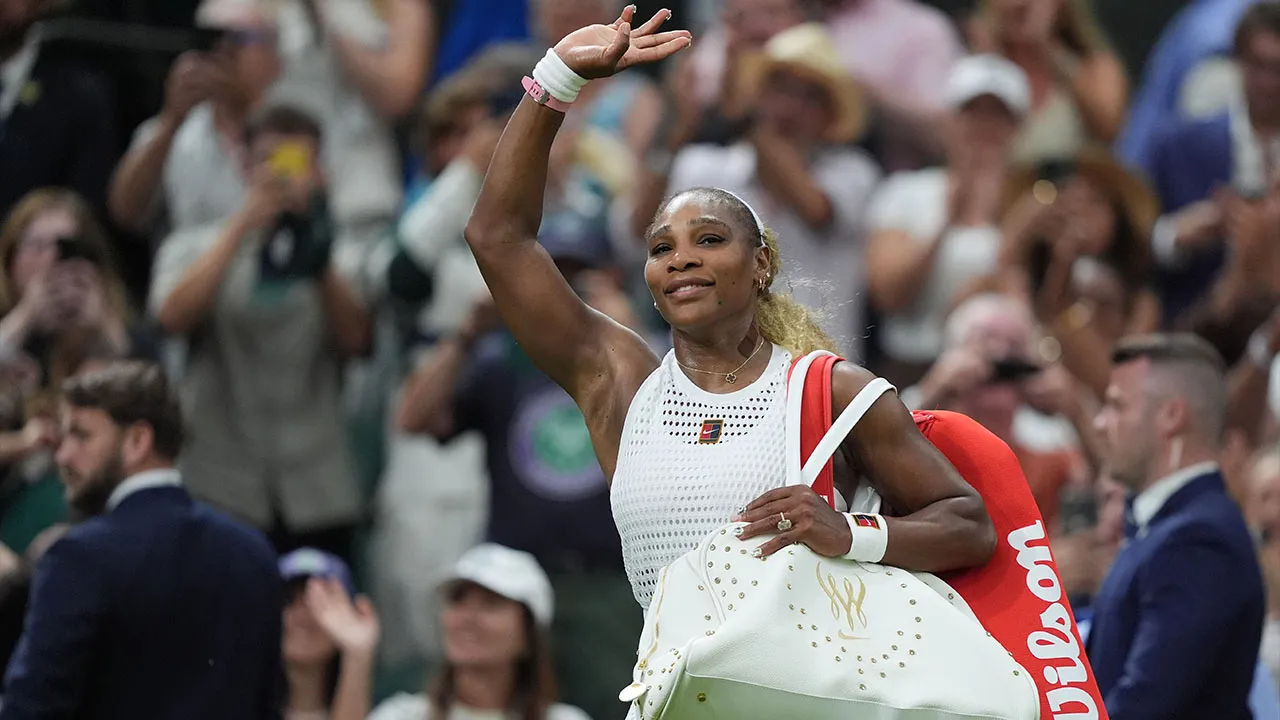 Serena Williams of the United States greets the audience as she leaves after losing to Maya Joint of Australia in their first round women's singles match at the Wimbledon Tennis Championships in London, Tuesday, June 30, 2026. (AP Photo/Maja Smiejkowska)