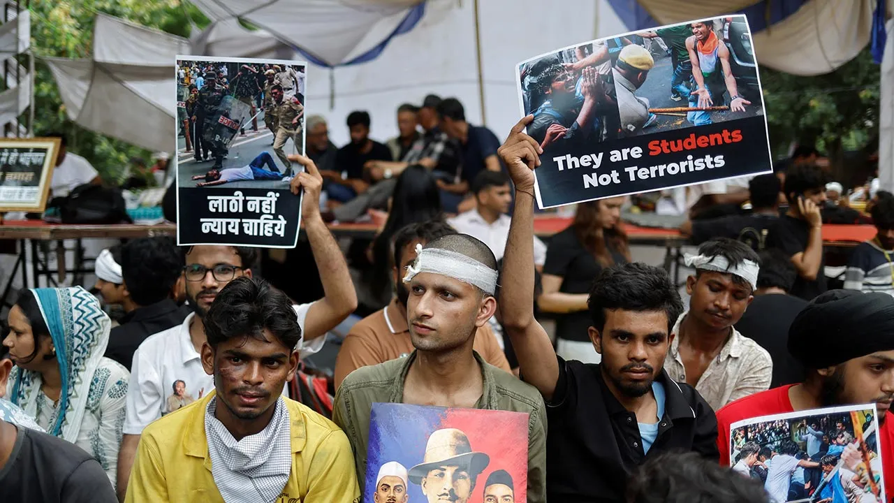 Injured supporters of India's Cockroach Janta Party (CJP) sits at a protest site, a day after thousands of protesters marched toward parliament demanding the resignation of Education Minister Dharmendra Pradhan over examination paper leaks, at Jantar Mantar in New Delhi, India, July 21, 2026. REUTERS/Adnan Abidi