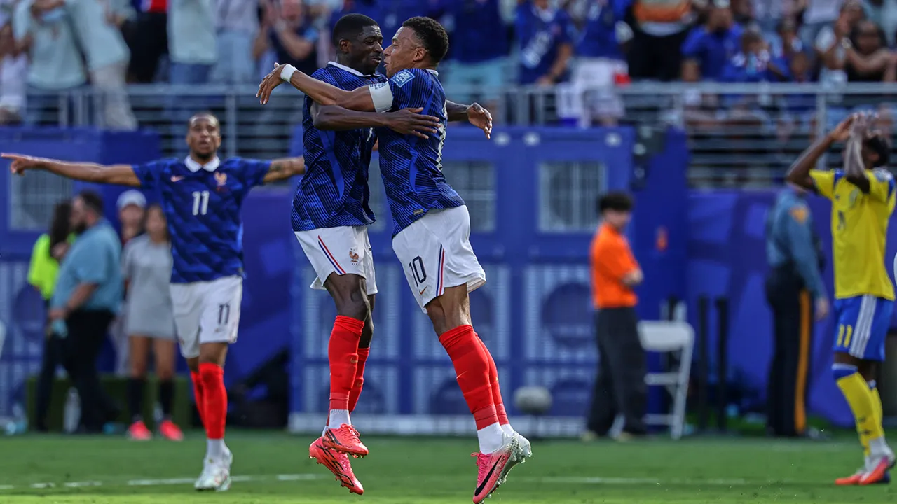 -France's Kylian Mbappe (10) celebrates their first goal with Ousmane Dembele, left, during the World Cup round of 32 soccer match between France and Sweden in East Rutherford, N.J., near New York, Tuesday, June 30, 2026. (AP Photo/Adam Hunger)
