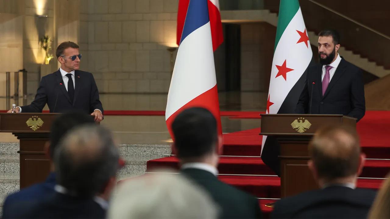 Title: Syria France Explosions Image ID: 26188522109713 Article:  French President Emmanuel Macron, left, listens to Syrian President Ahmad al-Sharaa during a joint press conference at the presidential palace in Damascus, Syria, Tuesday, July 7, 2026. (AP Photo/Ghaith Alsayed)