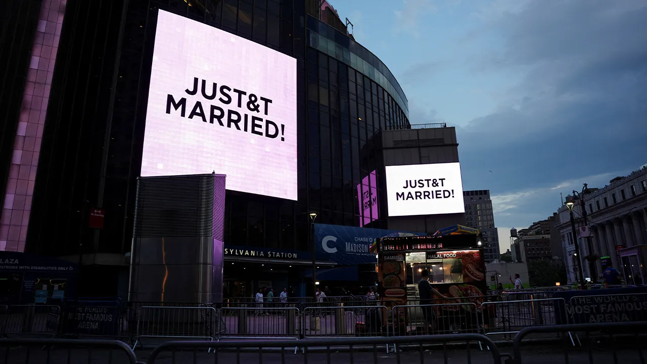 A screen displays a message referencing singer Taylor Swift and National Football League (NFL) player Travis Kelce outside Madison Square Garden, the venue for their reported wedding celebrations, in New York, U.S., July 3, 2026. REUTERS/Angelina Katsanis