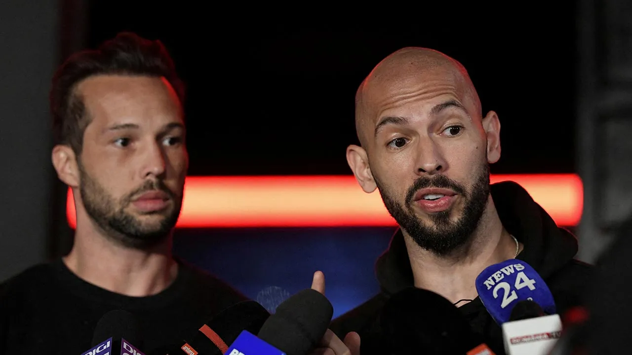 Tristan and Andrew Tate deliver a press statement in front of their house after landing back in Romania, near Bucharest, Romania, March 22, 2025. Inquam Photos/Eduard Vinatoru via REUTERS