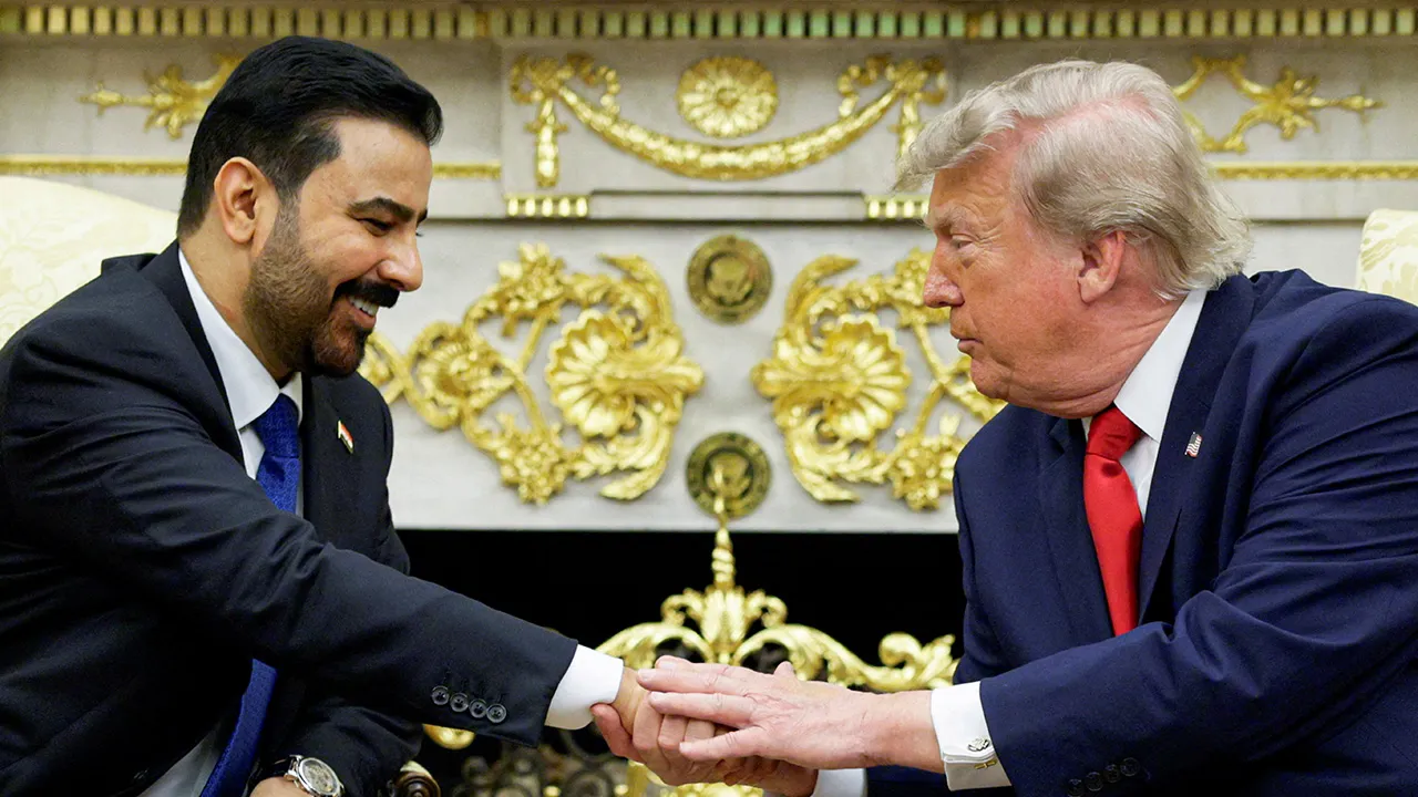 U.S. President Donald Trump shakes hands with Iraqi Prime Minister Ali al-Zaidi as they participate in a bilateral meeting in the Oval Office at the White House in Washington, D.C., U.S., July 14, 2026. REUTERS/Evan Vucci