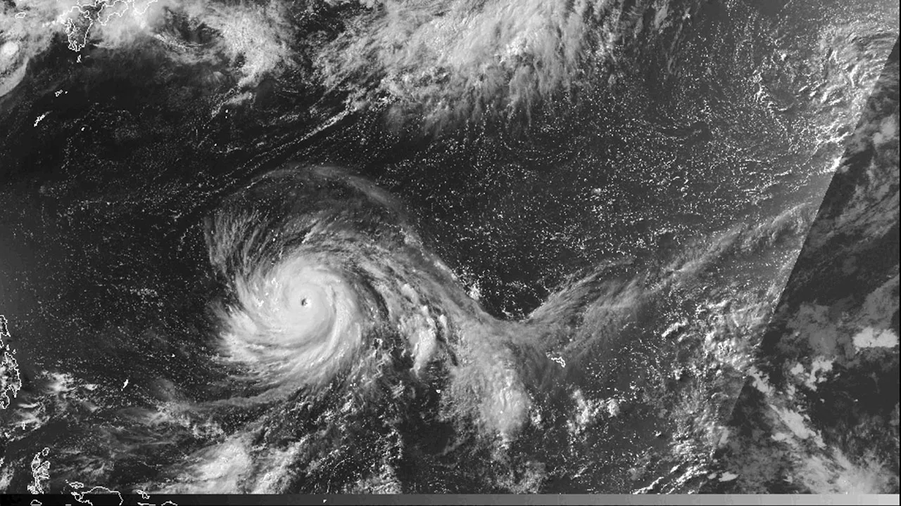 This satellite image from the National Oceanic and Atmospheric Administration shows Typhoon Bavi nearing the U.S. Pacific island territory of Guam on Sunday, July 5, 2026. (NOAA via AP)