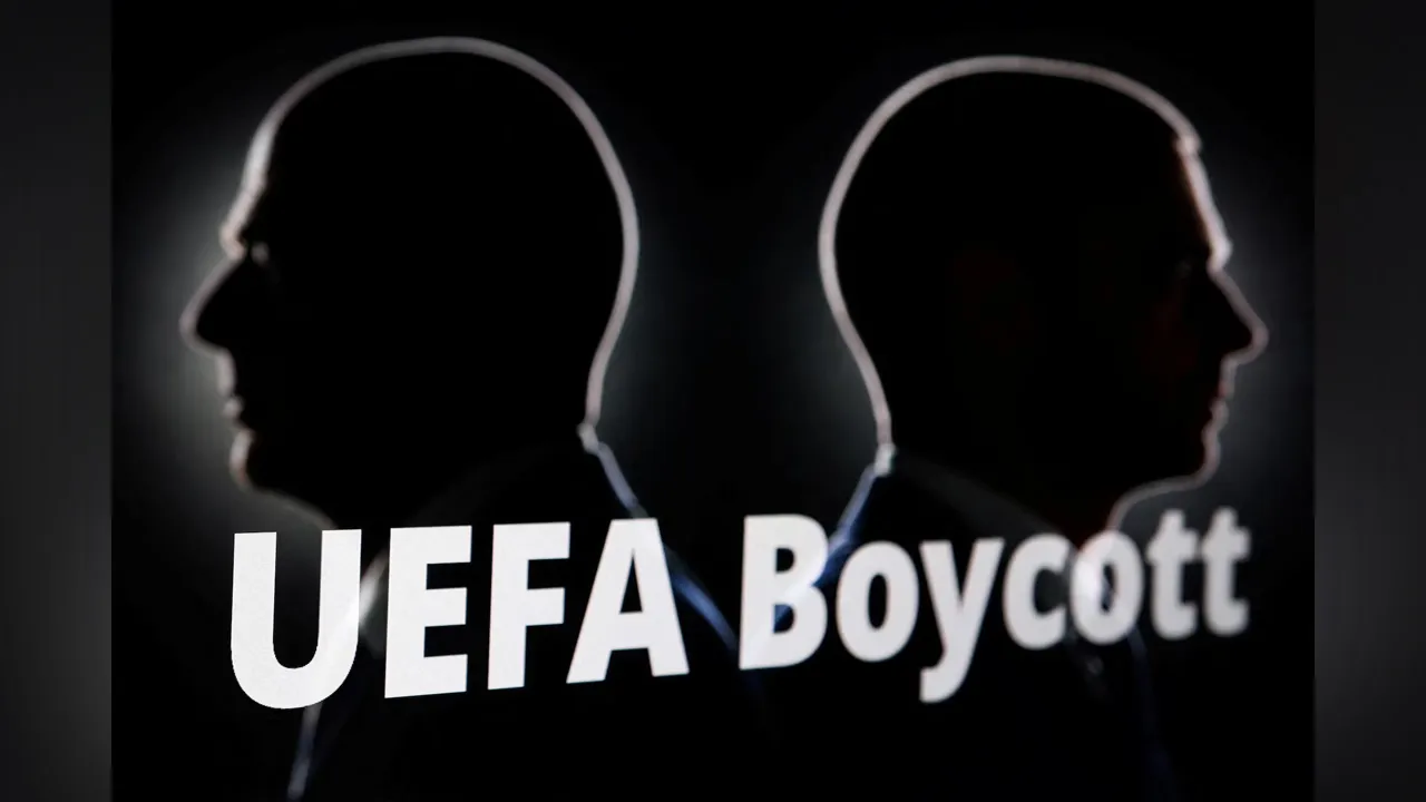 Silhouettes depicting FIFA President Gianni Infantino and UEFA President Aleksander Ceferin are seen next to text that reads "UEFA Boycott" in this illustration taken July 30, 2026. REUTERS/Dado Ruvic/Illustration Purchase Licensing Rights