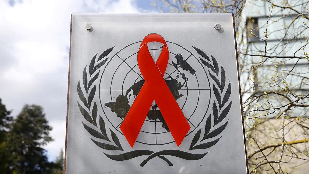 A logo is pictured outside a building of the United Nations AIDS agency (UNAIDS) in Geneva, Switzerland, April 6, 2021. Picture taken April 6, 2021. REUTERS/Denis Balibouse/File Photo