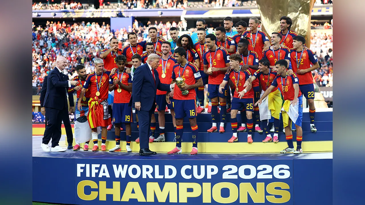Soccer Football - FIFA World Cup 2026 - Final - Spain v Argentina - New York/New Jersey Stadium, East Rutherford, New Jersey, U.S. - July 19, 2026 U.S. President Donald Trump hands with World Cup trophy to Spain's Rodri as they celebrate winning the World Cup REUTERS/Hannah Mckay
