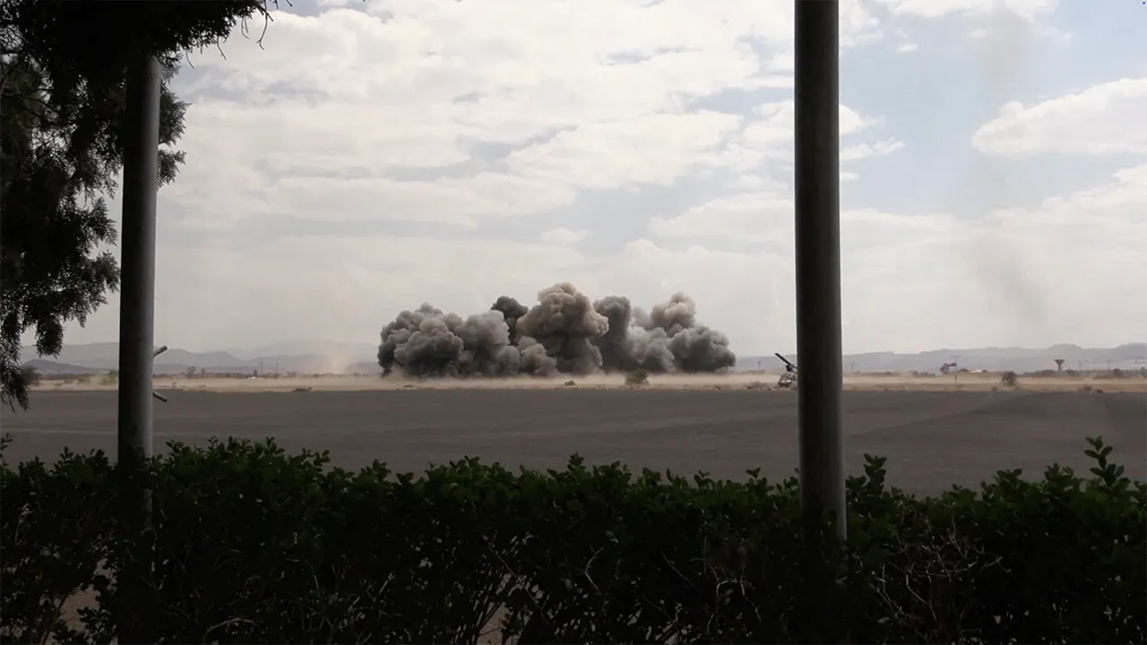 Smoke rises following an airstrike at Sanaa International Airport, in Sanaa, Yemen, July 13, 2026, in this screengrab taken from a video. AL MASIRAH/Handout via REUTERS
