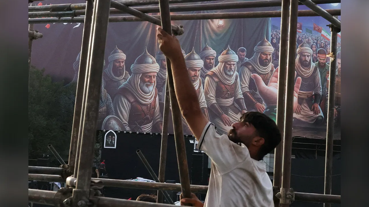 A worker holds a scaffolding element during preparations for a farewell ceremony for Iran's late Supreme Leader Ayatollah Ali Khamenei at Enghelab Square in Tehran, Iran, July 2, 2026. REUTERS/Mohammed Salem Foreign media in Iran operate under guidelines set by the Ministry of Culture and Islamic Guidance, which regulates press activity and permissions ISRAEL OUT. NO COMMERCIAL OR EDITORIAL SALES IN ISRAEL. NO ACCESS FOR ISRAELI MEDIA. NO USE BBC PERSIAN. NO USE VOA PERSIAN. NO USE MANOTO. NO USE IRAN INTER