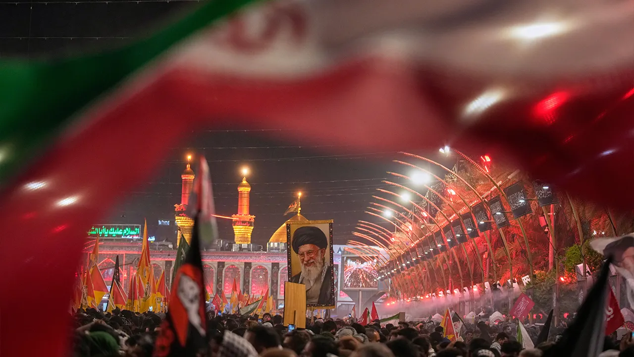 Mourners wait for the arrival of the funeral procession of the late Iranian Supreme Leader Ayatollah Ali Khamenei outside the Imam Hussein Shrine in Karbala, Iraq, Wednesday, July 8, 2026. (AP Photo/Khalil Hamra)