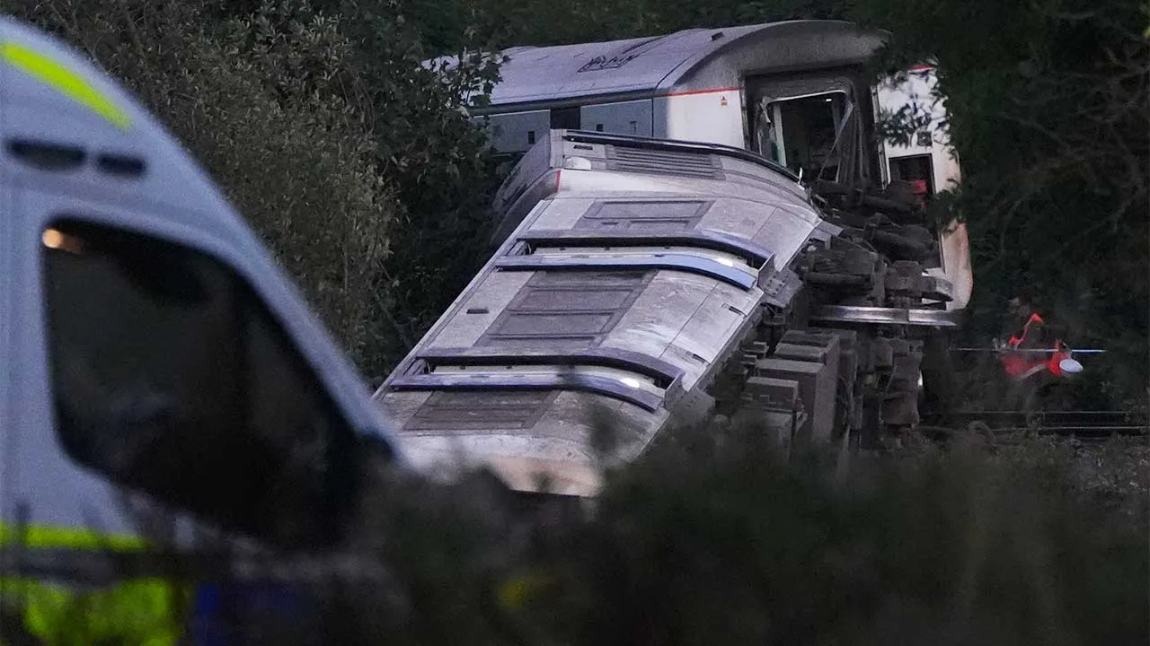 A train with around 150 people aboard derailed near the Lewes, England, railway station in East Sussex on Thursday, Aug. 13, 2026. (Jonathan Brady/PA via AP)