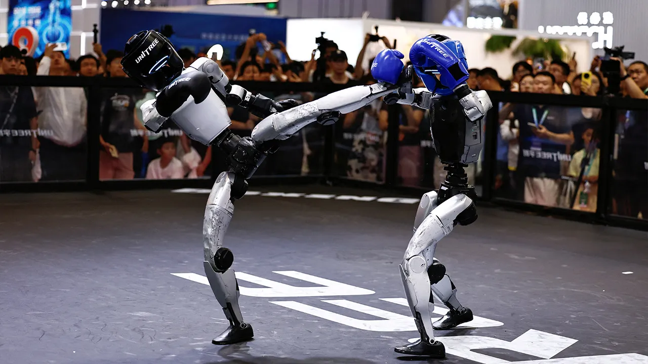 Humanoid robots by Unitree Robotics demonstrate kickboxing during the 2026 World Robot Conference, in Beijing, China August 19, 2026. REUTERS