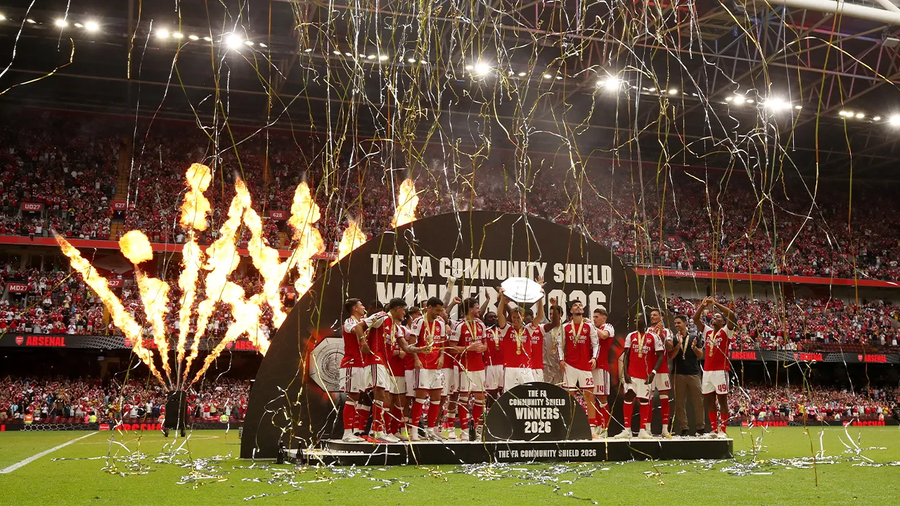 Soccer Football - FA Community Shield - Arsenal v Manchester City - Principality Stadium, Cardiff, Wales, Britain - August 16, 2026 Arsenal's Martin Odegaard lifts the trophy as he celebrates with teammates after winning the FA Community Shield REUTERS/Chris Radburn