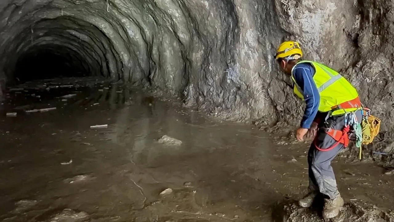 A rescuer works at the entrance of a tunnel at Chilime Hydropower Plant as rescue operations continue for people trapped inside following deadly flash floods and a mudslide, in Rasuwa, Nepal, August 29, 2026, in this screengrab obtained from a social media video. Ashish Gurung/via REUTERS