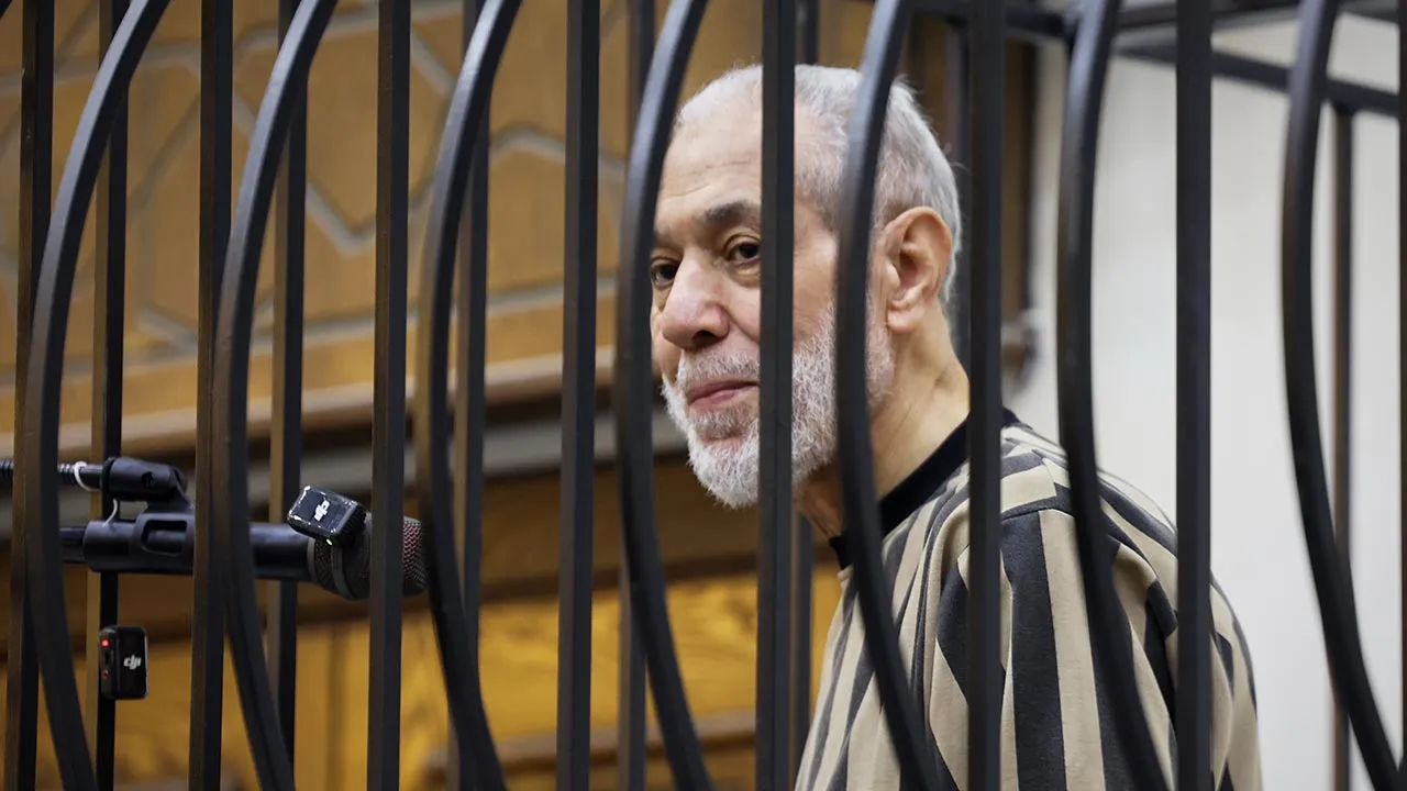 Syria's former grand mufti under ousted President Bashar Assad, Ahmad Badreddine Hassoun, stands as a court sentences him to life in prison at the Palace of Justice in Damascus, Syria, Monday, Aug. 24, 2026. (AP Photo/Ghaith Alsayed)